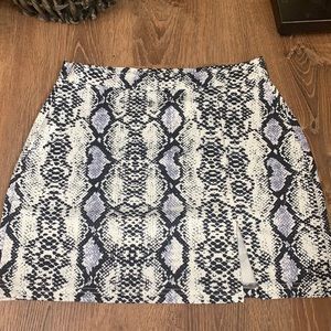White snakeskin miniskirt with slit